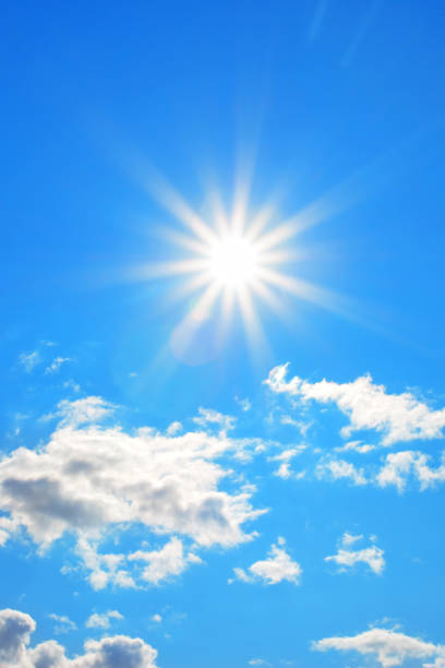 istock Sun with beautiful beams in the blue sky with some clouds 1148137082