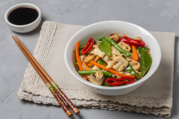 istock Chow Mein egg noodles with vegetables and mushrooms 1148137851