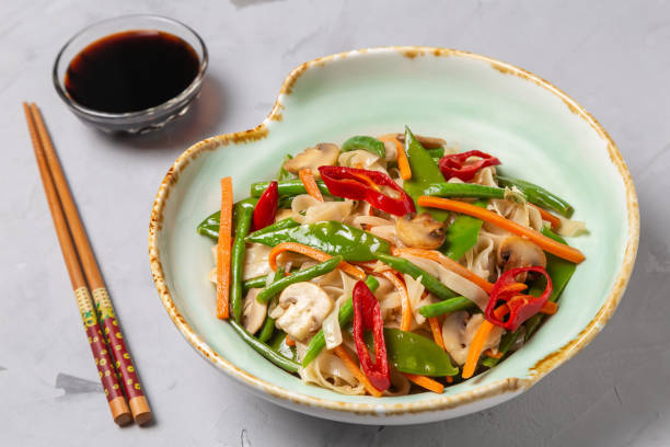 istock Chow Mein egg noodles with vegetables and mushrooms 1148137894