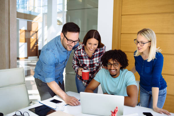 istock Business team brainstorming using laptop in an office 1148139640