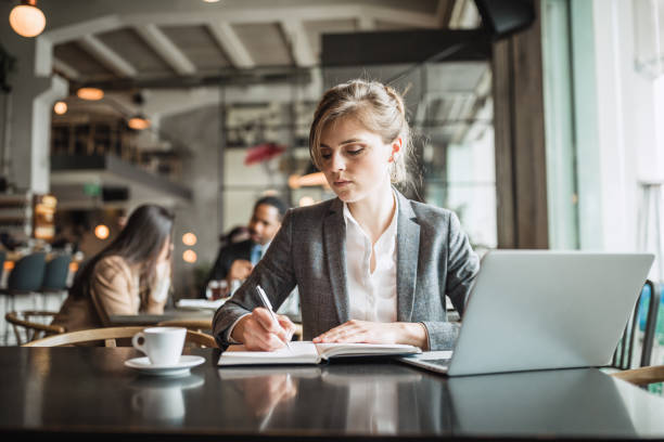 istock Businesswoman working on a coffee break 1148139667