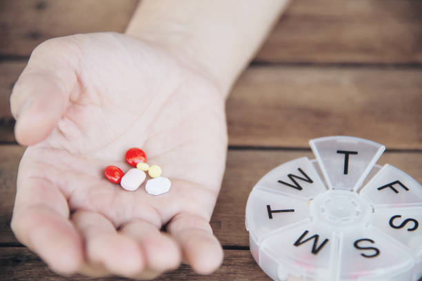 istock People prepare daily medicine tablet in pillbox 1148145769
