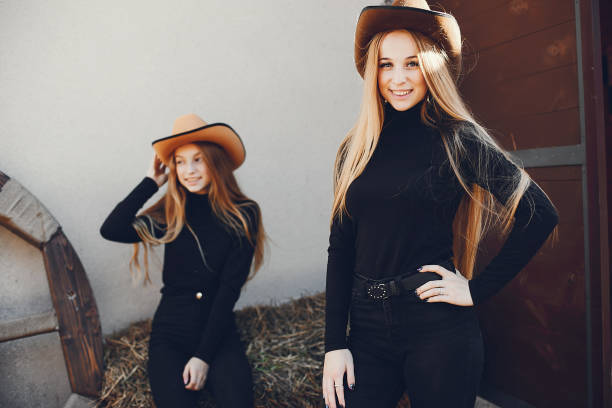 istock Girls in a cowboys hat on a ranch 1148147171