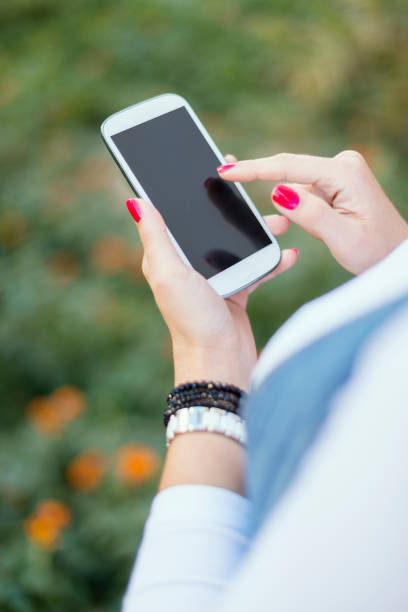 istock Close up of woman hands using smartphone 1148149093