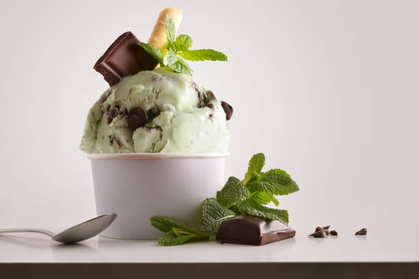 istock Composition of mint choco ice cream ball in paper cup 1148149227