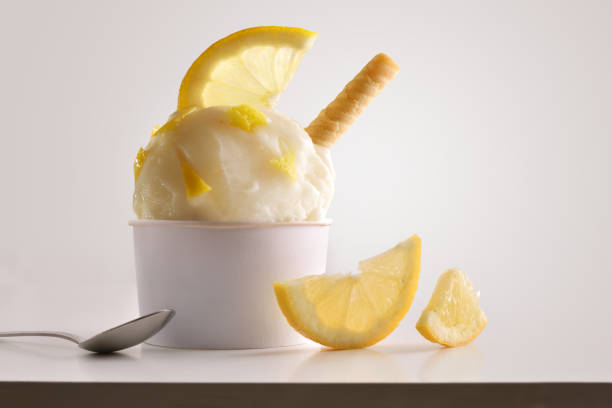 istock Composition of lemon ice cream ball in paper cup 1148149228