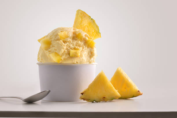istock Composition of pineapple ice cream ball in paper cup 1148149237