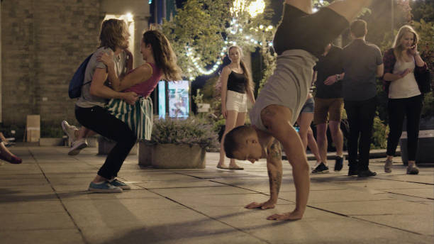 istock Summer night in the city. Crowd cheering and dancing 1148151074