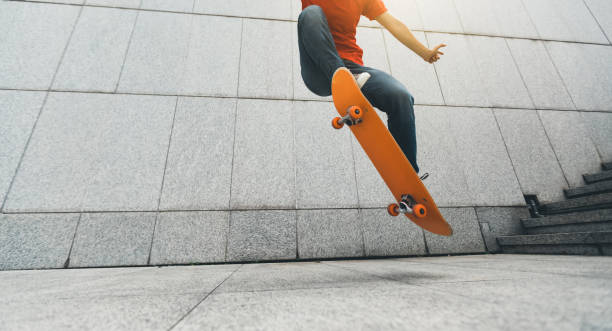 istock Skateboarder doing ollie at city 1148152229