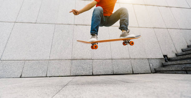istock Skateboarder doing ollie at city 1148152259