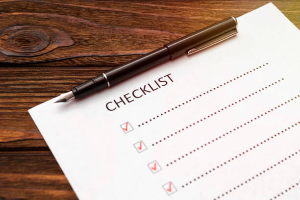 istock Checklist, fountain pen on wooden background. 1148152556
