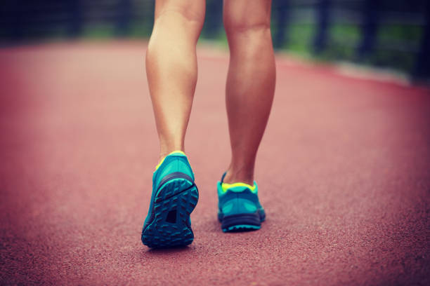 istock Young woman runner legs ready for running on trail 1148153426