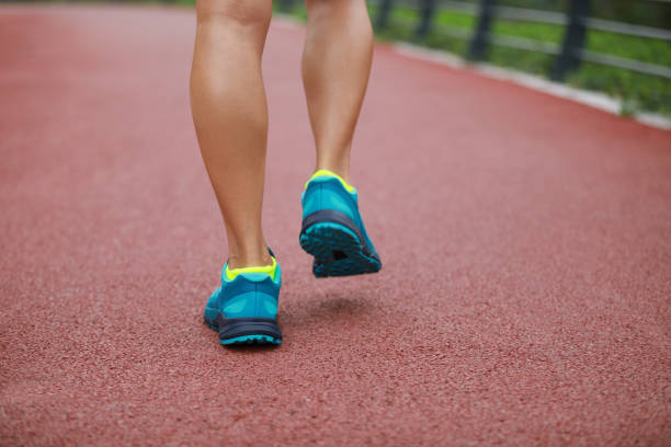 istock Young woman runner legs ready for running on trail 1148154095