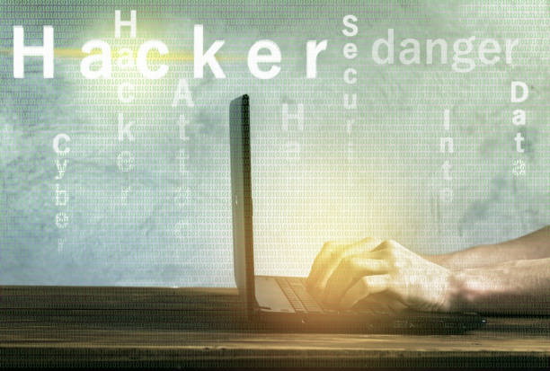 istock Cyber attack professional hacker. Man sits at the laptop and cracks access codes 1148154339