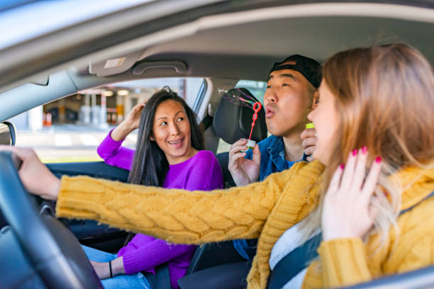 istock Carefree friends enjoying car trip 1148155276