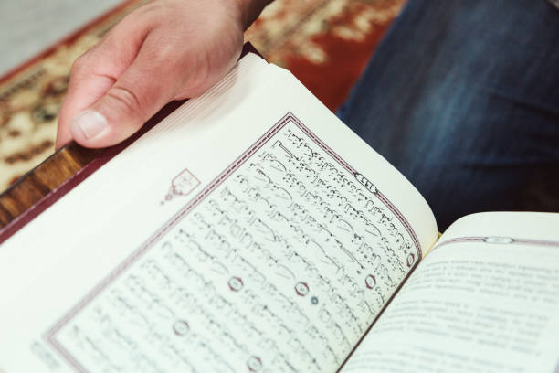 istock Midsection Of Man Reading Spiritual Book 1148157387