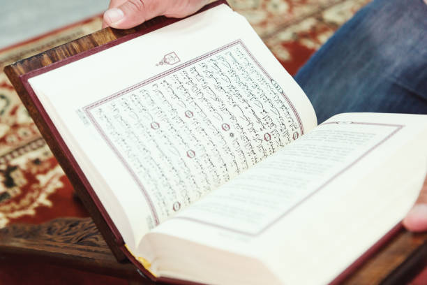 istock Midsection Of Man Reading Spiritual Book 1148157391