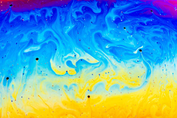 Soap bubble closeup. Abstraction background with bright acid colors.