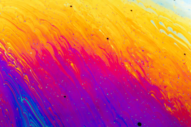 istock Abstract colorful liquid background. Macro shot of a soap bubble. 1148157493
