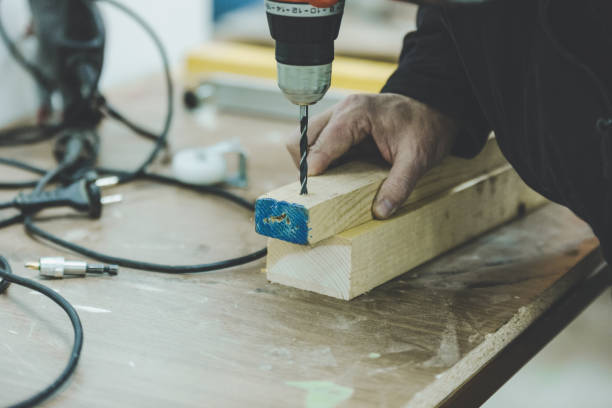 istock Close-Up Of Man Drilling Wood 1148158066