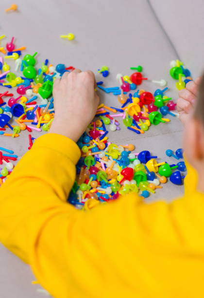 istock Close-Up Of Hand Playing Game On Table 1148158445
