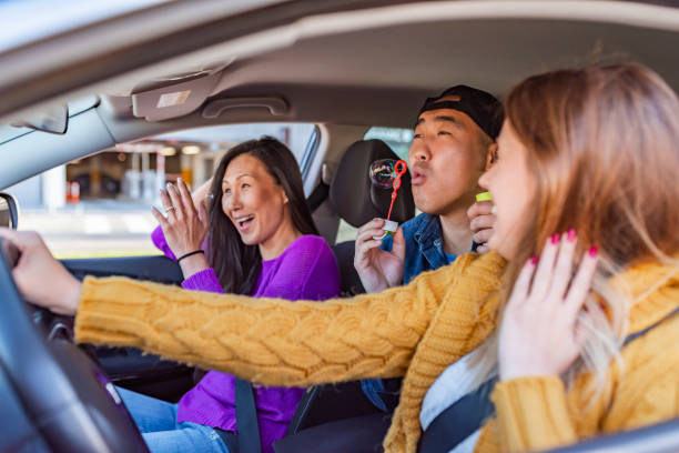 istock Friends Dancing at Car Interior 1148158599