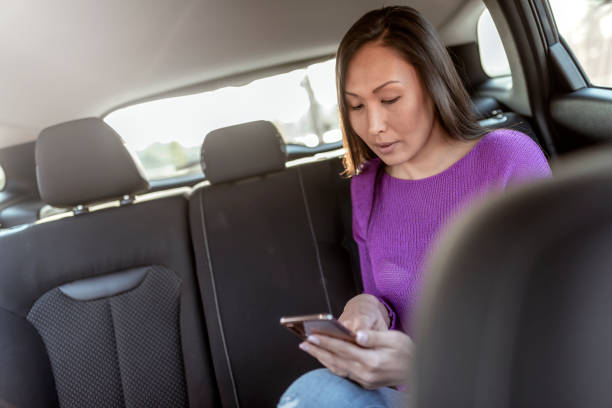 istock Woman in a taxi 1148160717