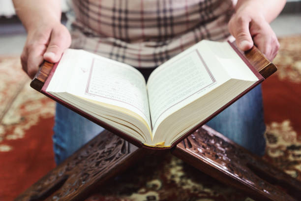 istock Midsection Of Man Reading Spiritual Book 1148161591
