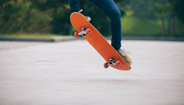 istock Skateboarder skateboarding  on parking lot 1148162965