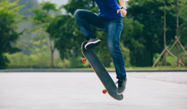 istock Skateboarder skateboarding  on parking lot 1148163049