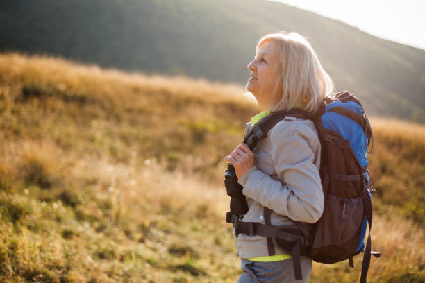 istock Senior woman hiking 1148163351