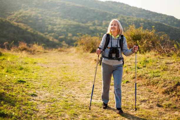 istock Senior woman hiking 1148164084
