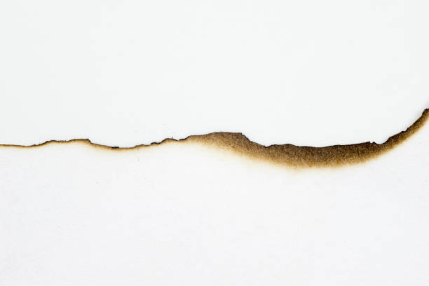 istock paper burned old grunge abstract background texture 1148165443