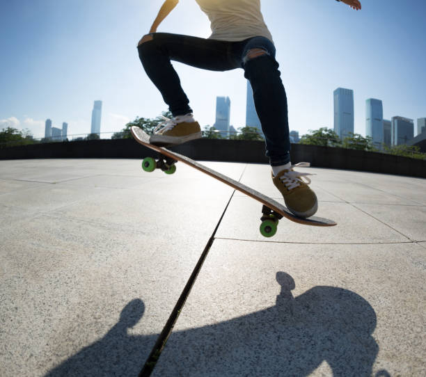 istock Skateboarder legs skateboarding at city 1148165801
