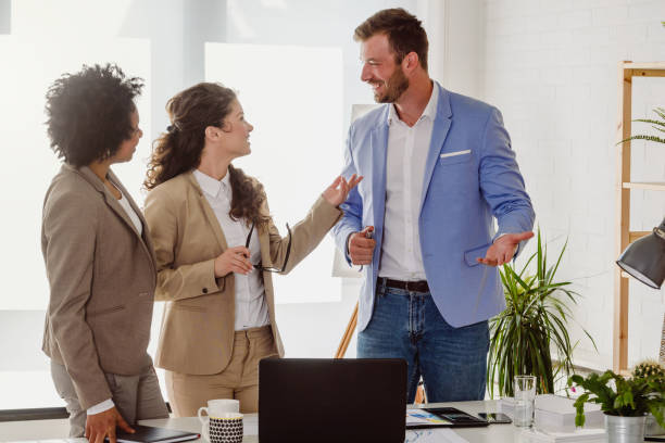 istock Diverse business team discussing work in their creative office 1148166080
