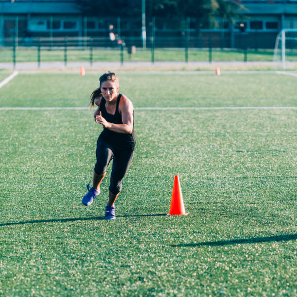 istock Female running on cross training competition 1148166171