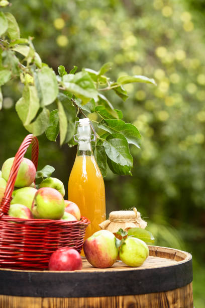 istock apples on background orchard standing on a barrel. Apple juice and apple preserves. 1148166855