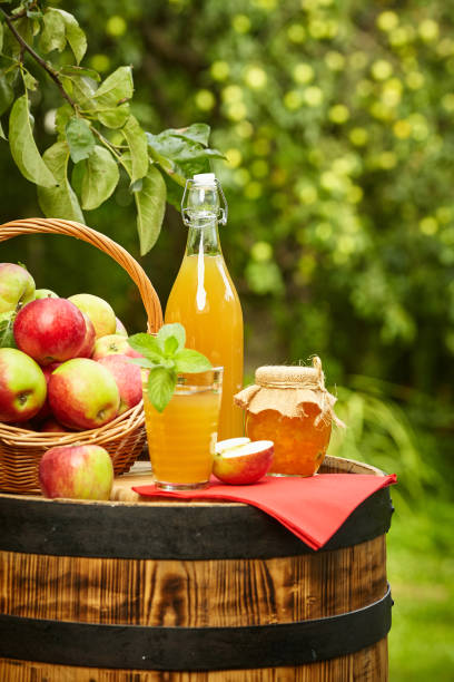istock apples on background orchard standing on a barrel. Apple juice and apple preserves. 1148166858