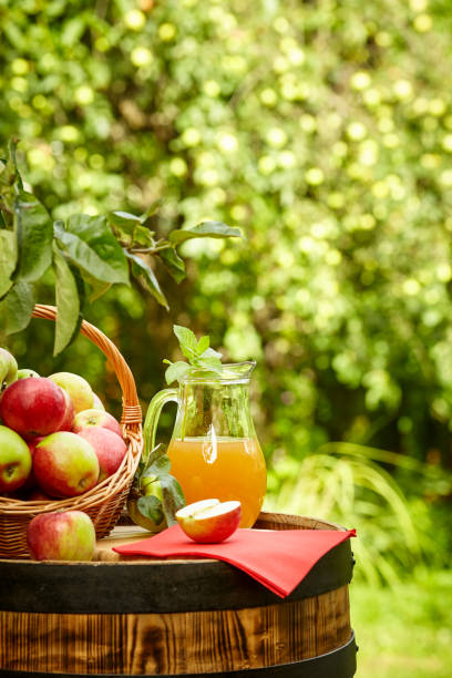 istock apples on background orchard standing on a barrel. Apple juice and apple preserves. 1148166859