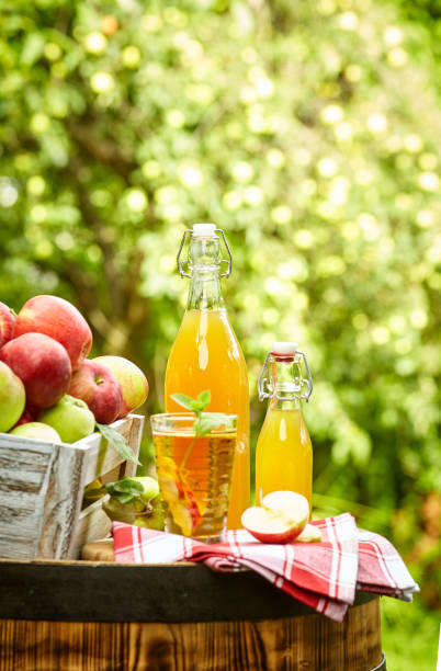 istock apples on background orchard standing on a barrel. Apple juice and apple preserves. 1148166862
