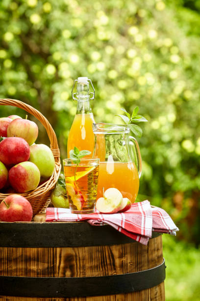 istock apples on background orchard standing on a barrel. Apple juice and apple preserves. 1148166863