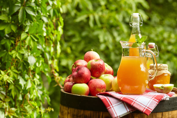 istock apples on background orchard standing on a barrel. Apple juice and apple preserves. 1148166879