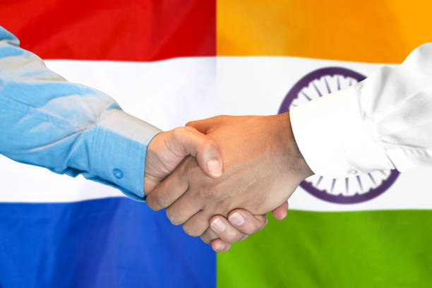 istock handshake on India and Netherlands flag background. 1148169885