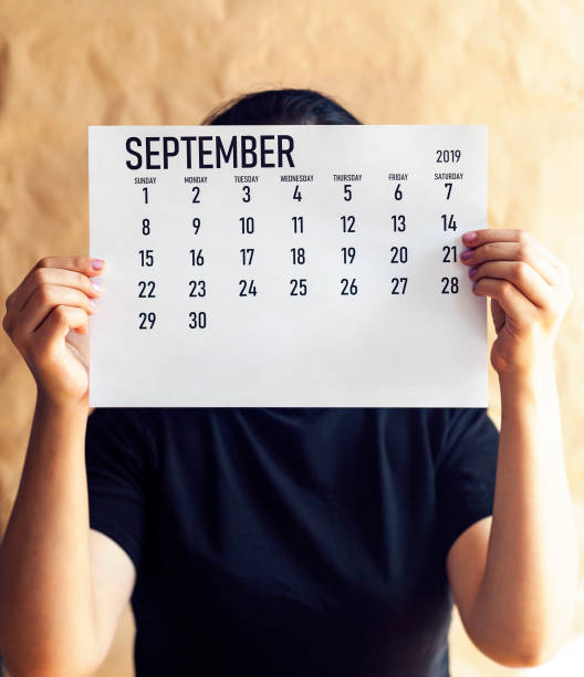 istock A woman holding simple September 2019 calendar 1148170048