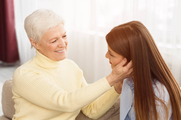 istock Happy mother and millennial daughter looking at each other 1148170225
