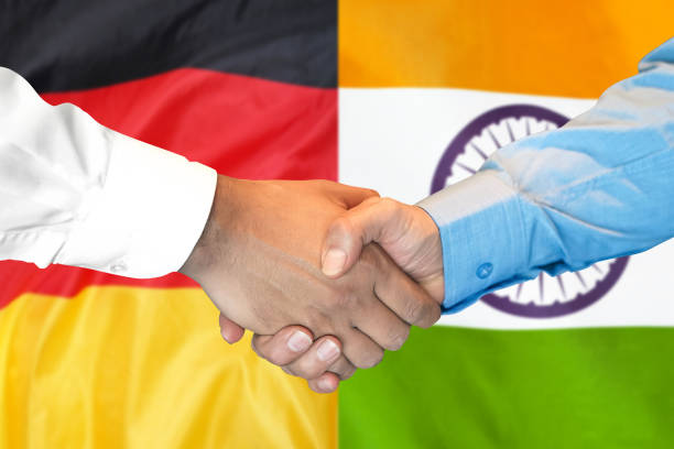 istock handshake on India and Germany flag background. 1148171244