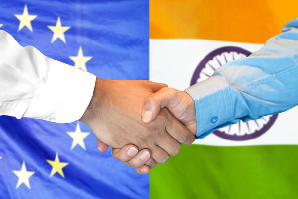 istock handshake on India and European Union flag background. 1148171359