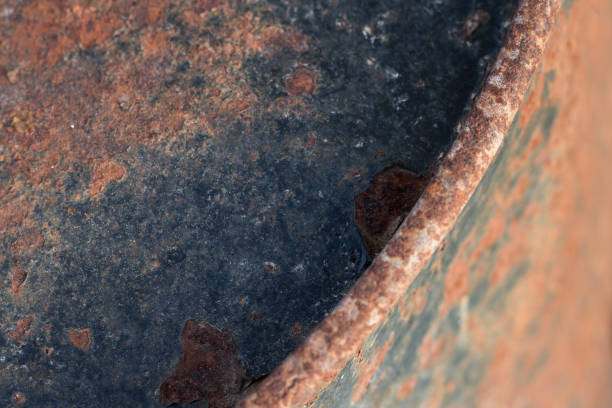 istock Rusty and painted textured metal barrel 1148171895