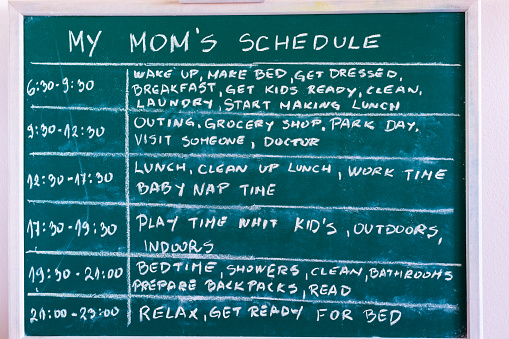 Mom's schedule written on the board.