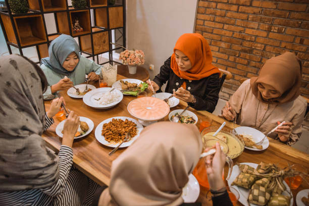 istock muslim people having dinner break fasting together 1148176538